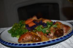 photo cooked pheasant breasts wrapped in pancetta with chesnuts and cider gravy
